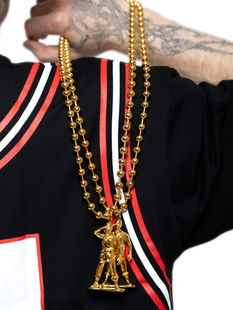 Gold plated LNA soldier chain worn over a black and red jersey